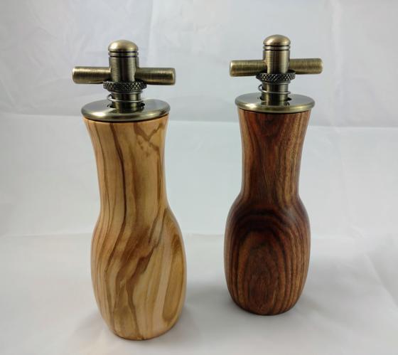 A pair of salt and pepper t-top grinders using olivewood and chechen.